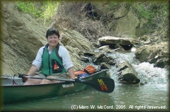 Jill Britt exploring a creek that feeds the Kiamichi River